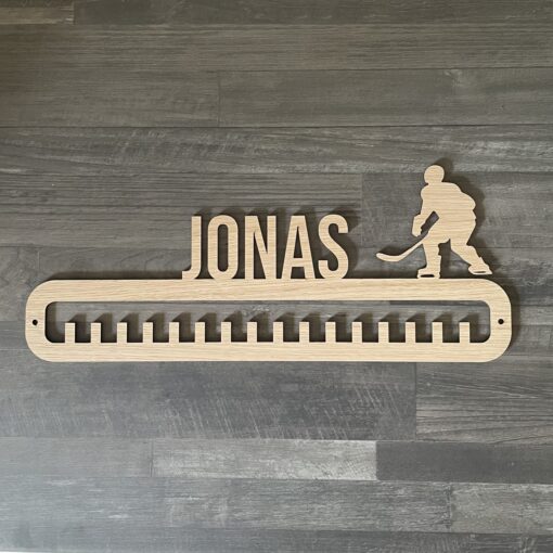 Ishockeyspiller - Medalje Holder Med Navn